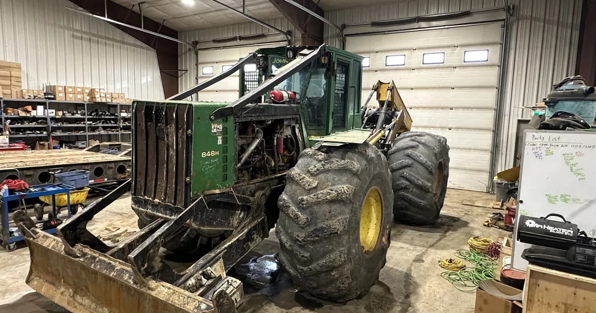 Working skidder in a Canadian logging operation